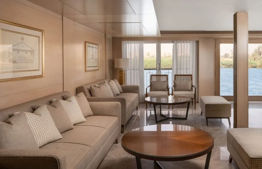 The elegant reception area of the MS Jaz Regent Nile Cruise, featuring comfortable seating, modern décor, and large windows with views of the Nile.