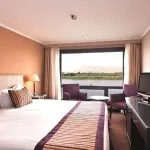 Cabin with a double bed and a view on the MS Crown Prince Nile Cruise.