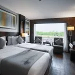 Twin-bedded cabin on MS Le Fayan with modern furnishings.