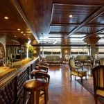 Elegant bar and lounge area with wooden decor on the MS Medea Nile Cruise