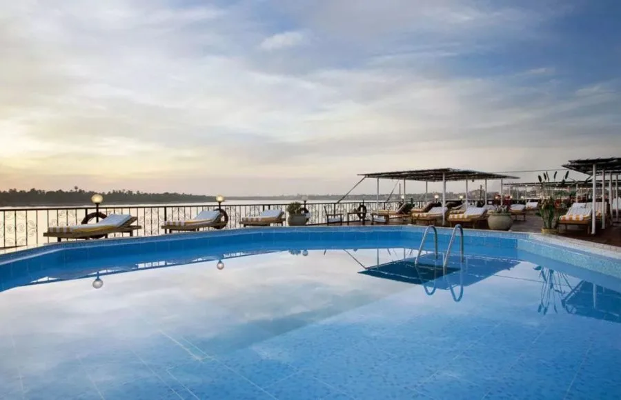 Sun deck swimming pool with lounge chairs on the MS Medea Nile Cruise