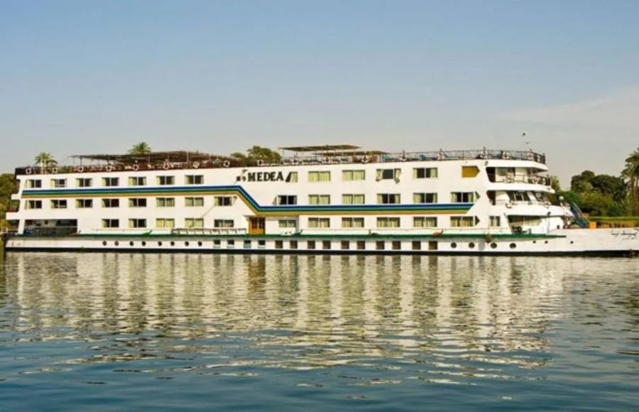 The classic white exterior of the MS Medea Nile Cruise ship sailing on the river
