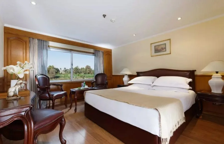 A cozy double cabin with river view window aboard the MS Medea Nile Cruise