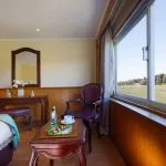 Standard cabin with a large panoramic window view on the MS Medea Nile Cruise