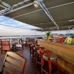 Outdoor bar and dining area with fresh fruit on the deck of the MS Medea Nile Cruise