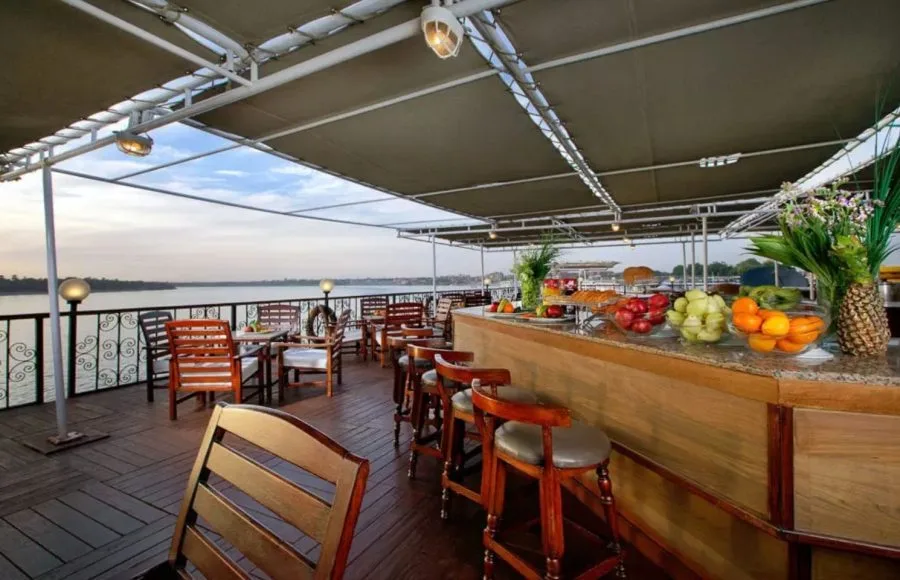 Outdoor bar and dining area with fresh fruit on the deck of the MS Medea Nile Cruise