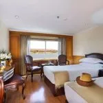 Comfortable twin cabin with a scenic window view on the MS Medea Nile Cruise