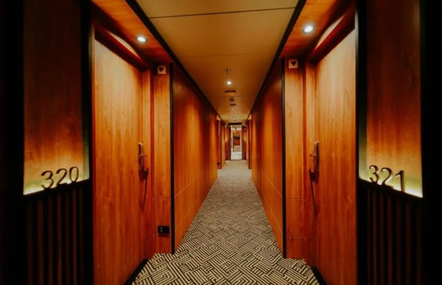 The brightly lit and elegantly paneled cabin corridor aboard the luxury MS Miriam nile cruise ship