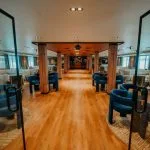 The expansive main lounge and bar area of the luxury MS Miriam nile cruise ship with ample seating and river views