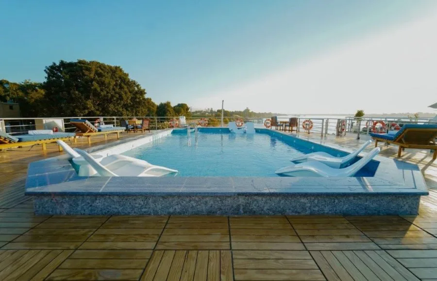 The sun deck pool on the luxurious MS Miriam nile cruise ship offering lounge chairs and beautiful views