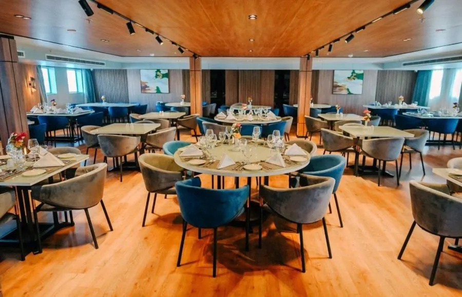 The elegant and spacious dining room with modern seating arrangements aboard the MS Miriam Nile Cruise