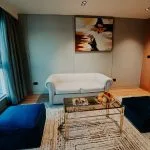 The stylish and modern sitting area of a suite on the MS Miriam Nile Cruise with a stunning river view