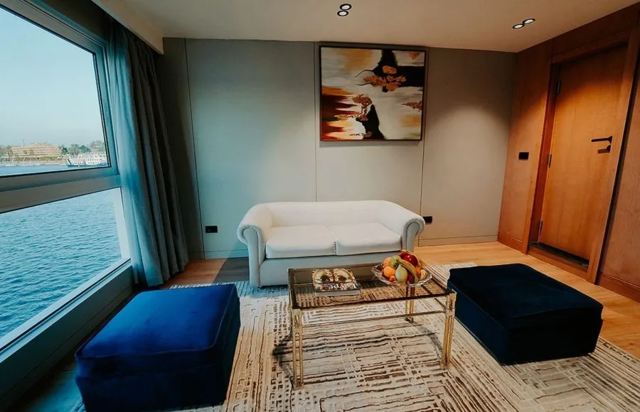 The stylish and modern sitting area of a suite on the MS Miriam Nile Cruise with a stunning river view