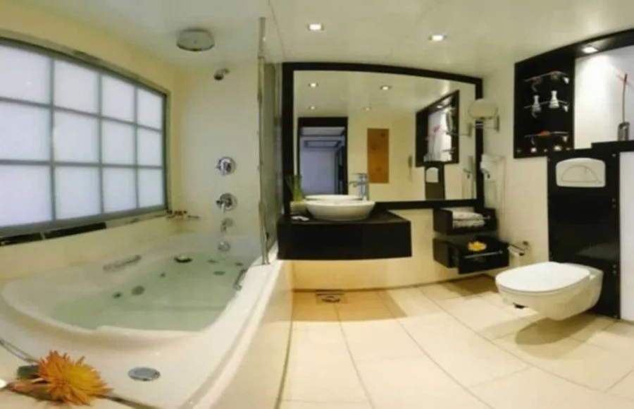 Modern bathroom with a jacuzzi tub in a suite on the Movenpick Royal Lily Nile Cruise