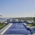 The sun deck and pool area of the Movenpick Royal Lily Nile Cruise offering stunning river views