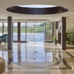The elegant lobby of the Movenpick Royal Lily Nile Cruise with large windows overlooking the river