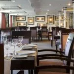 The elegantly set dining room and restaurant onboard the Movenpick Royal Lily Nile Cruise