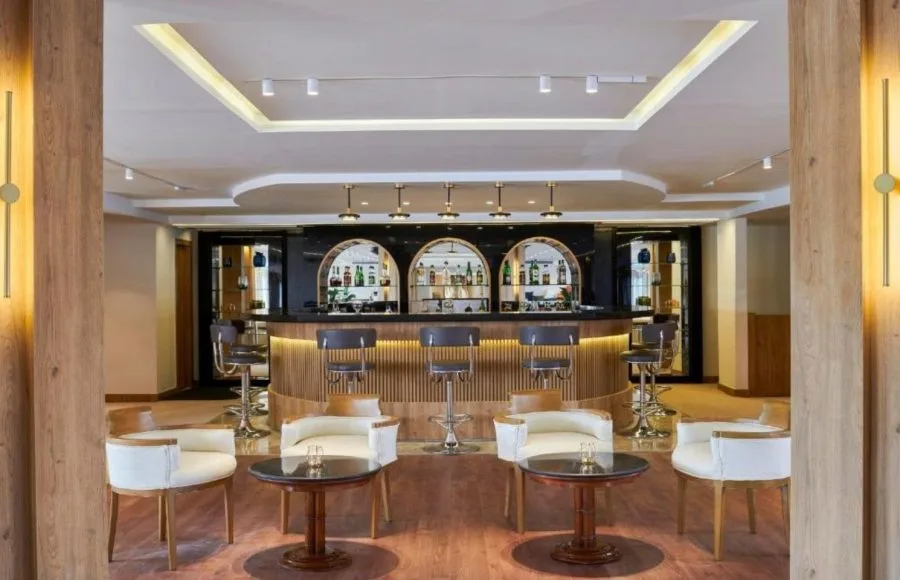 The stylish bar area of the Mövenpick MS Royal Lotus Nile Cruise features comfortable seating and a well-stocked counter.