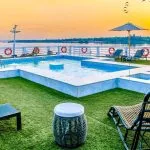 Movenpick MS Sunray swimming pool on the sun deck at sunset overlooking the beautiful Nile River.