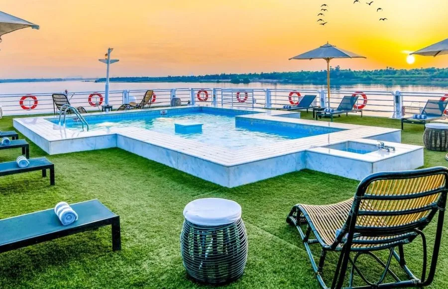 Movenpick MS Sunray swimming pool on the sun deck at sunset overlooking the beautiful Nile River.