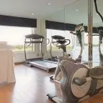 Onboard gymnasium with cardio equipment and large windows on the ms nile premium cruise perfect for maintaining your fitness routine.