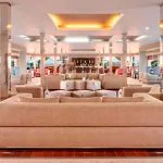Spacious and well-lit lounge bar with plush seating on the luxurious Ms Nile Premium cruise ship perfect for evening drinks.