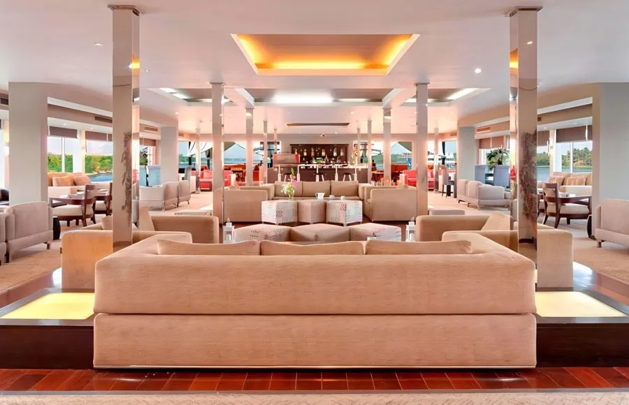 Spacious and well-lit lounge bar with plush seating on the luxurious Ms Nile Premium cruise ship perfect for evening drinks.