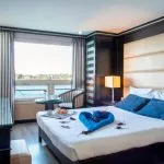 Elegant double cabin aboard the MS Nile Style Cruise Ship with a stunning panoramic view of the river.
