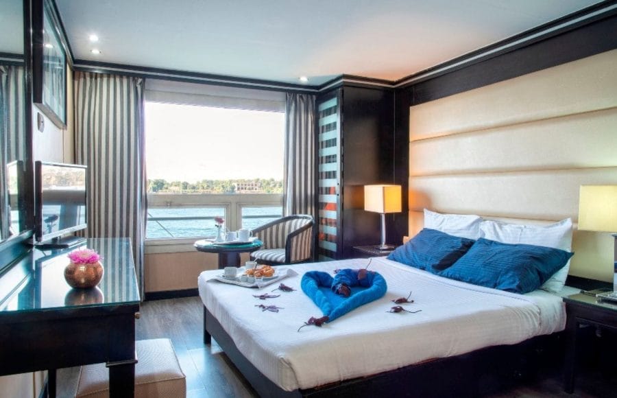 Elegant double cabin aboard the MS Nile Style Cruise Ship with a stunning panoramic view of the river.