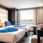 MS Nile Style Cruise Ship cabin with twin beds offering a magnificent Nile view and elegant decor.