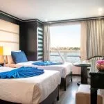 MS Nile Style Cruise Ship cabin with twin beds offering a magnificent Nile view and elegant decor.
