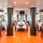 The spacious and elegant main restaurant of the MS Nile Style Cruise Ship, ready for dining.