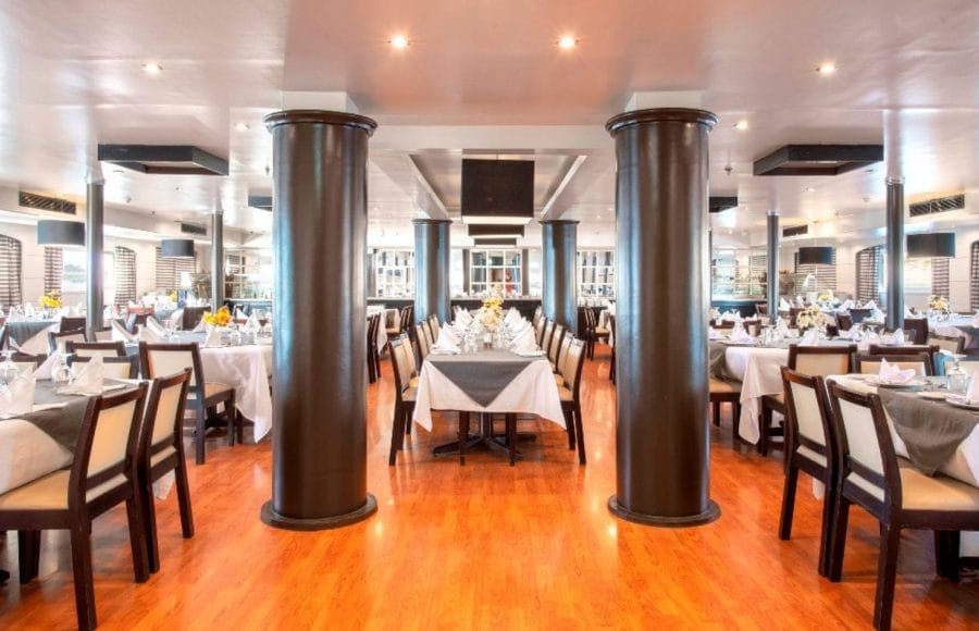 The spacious and elegant main restaurant of the MS Nile Style Cruise Ship, ready for dining.