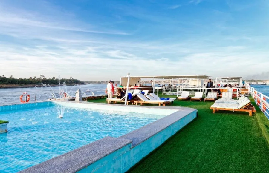 Guests enjoying the refreshing swimming pool and sun deck aboard the MS Nile Style Cruise Ship.