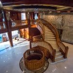 The elegant lobby of the Princess Sarah I Nile Cruise featuring rich wooden paneling and luxurious decor.