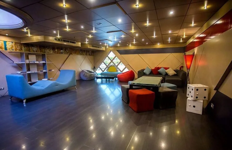 A contemporary lounge area with colorful seating, bean bags, on the Princess Sarah I Nile Cruise.