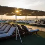 The sun deck of the MS Princess Sarah II Nile Cruise with covered relaxation area.