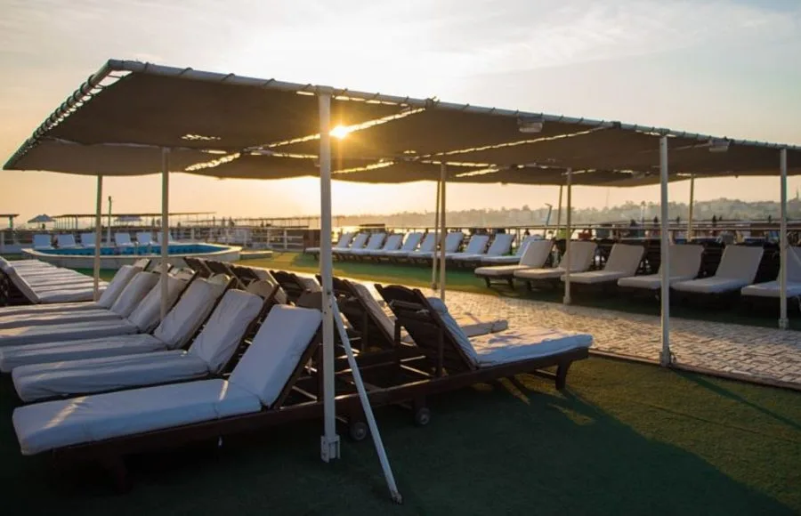 The sun deck of the MS Princess Sarah II Nile Cruise with covered relaxation area.