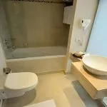 A clean and modern bathroom on the MS Salima Nile Cruise ship, featuring a sink and bathtub