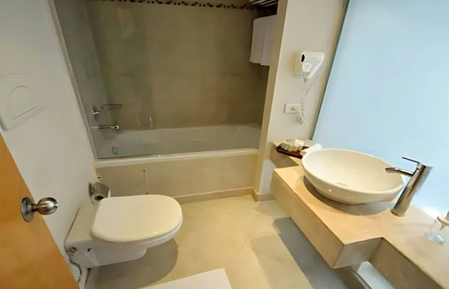 A clean and modern bathroom on the MS Salima Nile Cruise ship, featuring a sink and bathtub