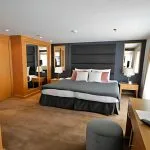 A luxurious cabin aboard the MS Salima Nile Cruise, featuring a king-sized bed and elegant furnishings