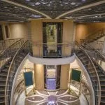 The entrance of the Sunrise MS Semiramis 1 Nile Cruise with a central elevator and staircases.
