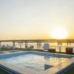 The sun deck pool on the MS Semiramis I Nile Cruise, with lounge chairs and tables.