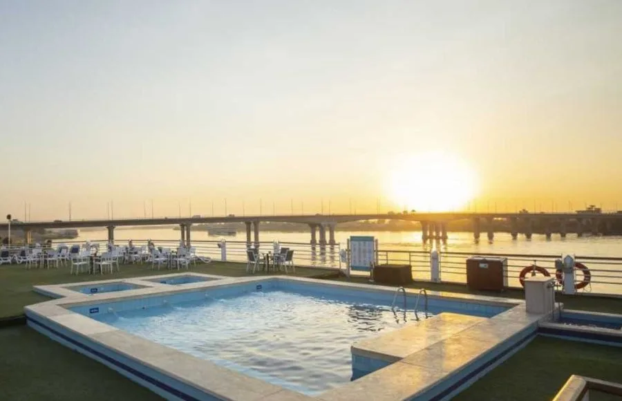 The sun deck pool on the MS Semiramis I Nile Cruise, with lounge chairs and tables.