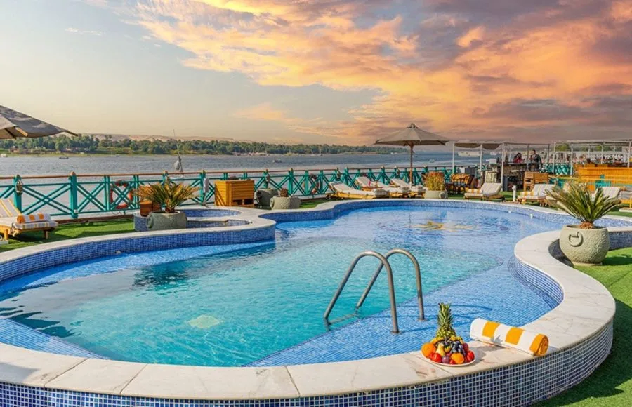 the inviting swimming pool on the sun deck of the Sonesta Moon Goddess Nile Cruise ship, perfect for a refreshing dip under the Egyptian sun.