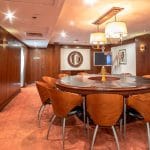 The elegant meeting room aboard the MS Nile Goddess Nile Cruise, featuring a large circular table and modern decor.