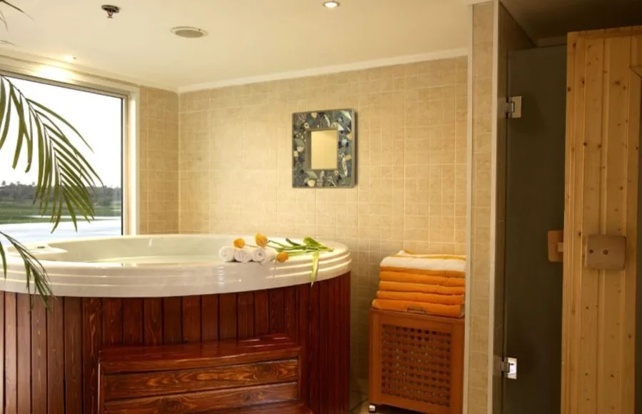 A luxurious spa area on the Sonesta Star Goddess Nile cruise ship, featuring a relaxing jacuzzi and a sauna, perfect for unwinding after a day of exploration.