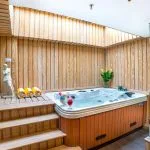 The relaxing sauna and jacuzzi area on the Sonesta Sun Goddess Nile cruise ship, featuring a wooden deck and a soothing atmosphere.