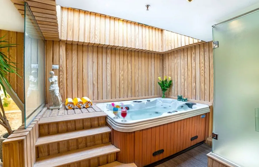 The relaxing sauna and jacuzzi area on the Sonesta Sun Goddess Nile cruise ship, featuring a wooden deck and a soothing atmosphere.