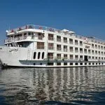 The Steigenberger Legacy Nile Cruise ship sailing on the river.